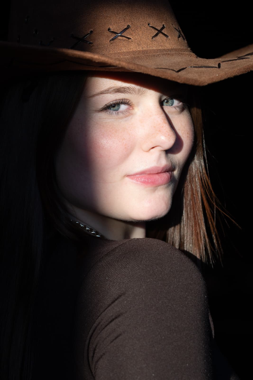 Woman with cowboy hat portrait